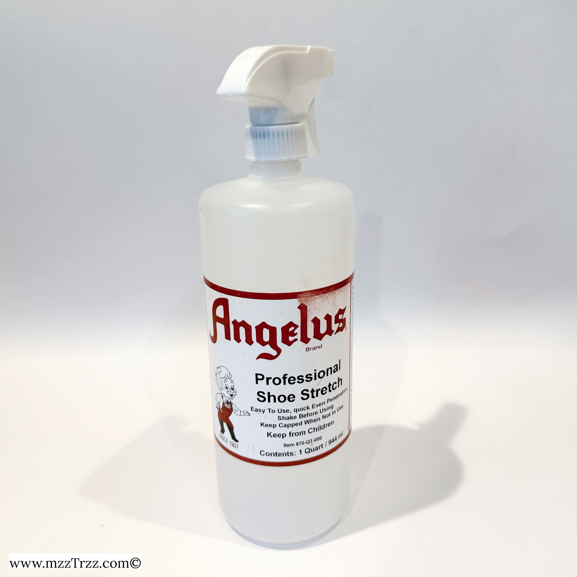 A white plastic spray bottle with a red label that reads 'Angelus Professional Shoe Stretch', intended for stretching and cleaning leather shoes.